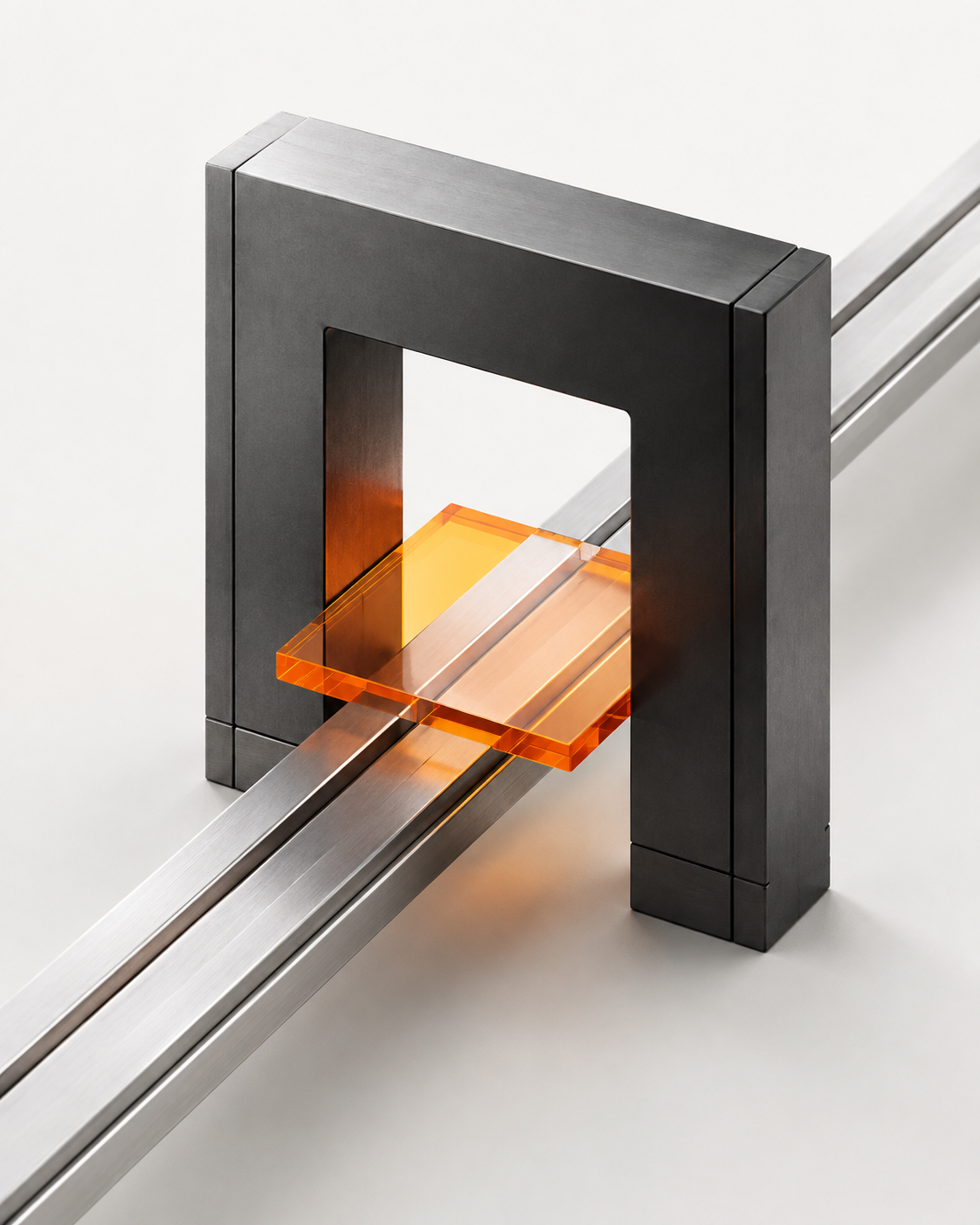 An orange execution unit passing through a precision metal gate on parallel rails